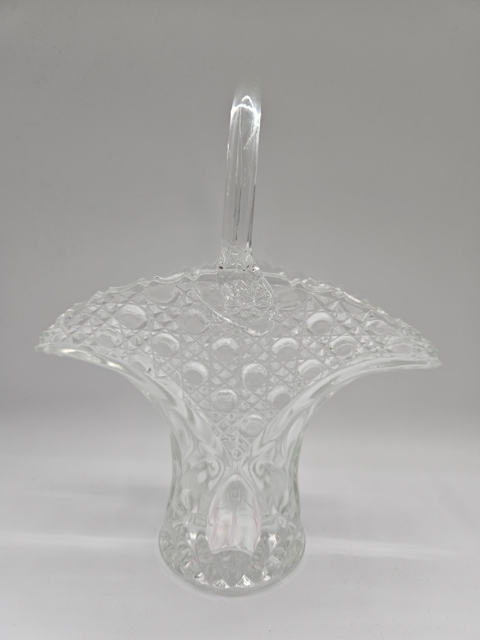 American Brilliant Cut Glass Basket: American Brilliant Period cut glass basket with handle. Dimensions: H: 13 in, W: 10 in, L: 5 in.