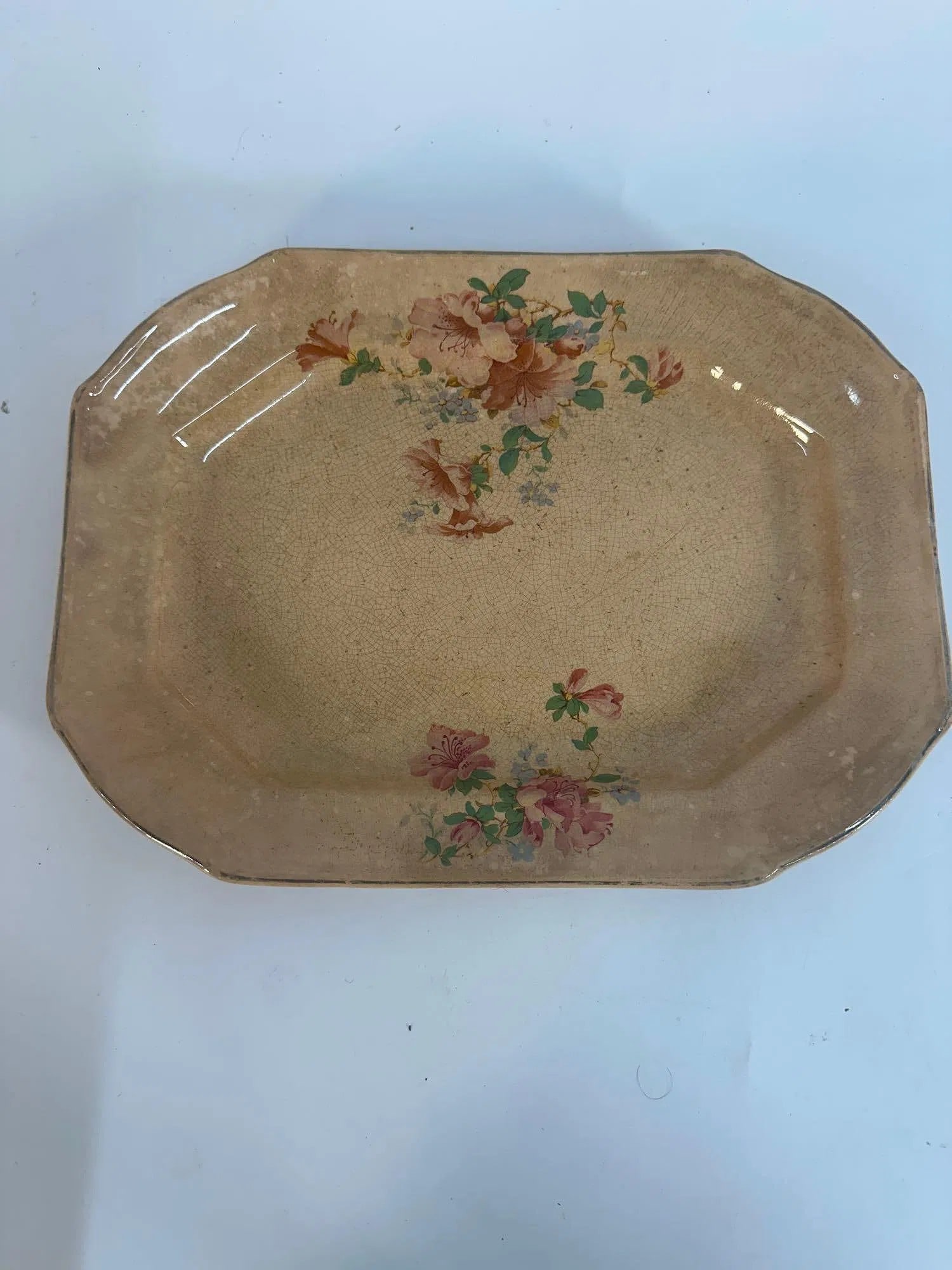 Vintage Taylor Smith & Taylor Ceramic Decal Platter B7: This antique octagonal ceramic platter showcases a classic floral transferware design, featuring delicate pink and peach roses with green foliage. The warm beige or cream-toned glaze exhibits a charmi