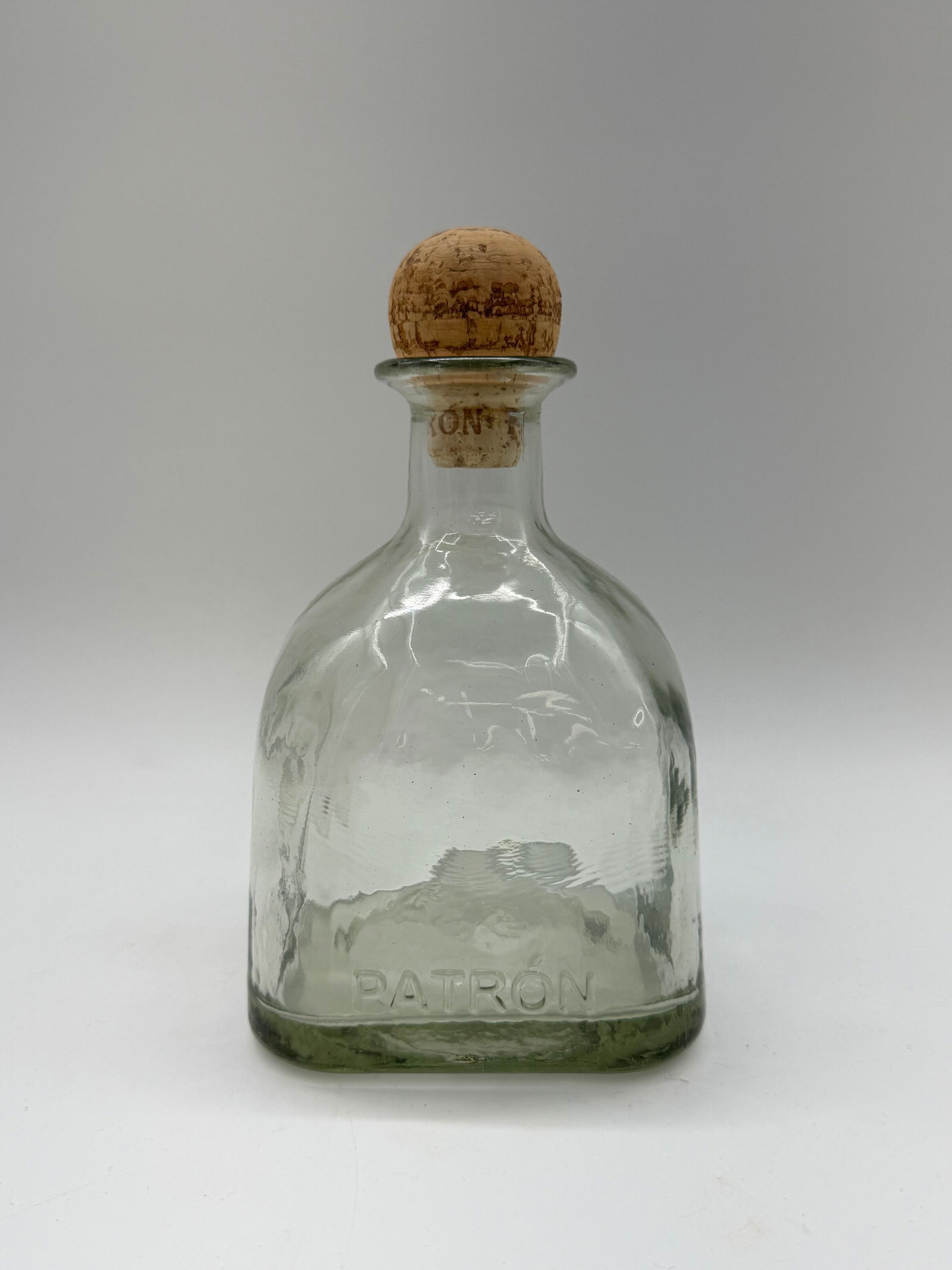 Glass Decanter: Decanter with cork stopper. Height: 8 inches, Width: 4 inches.