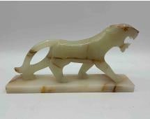 Carved Onyx Panther Sculpture: Hand-carved onyx sculpture depicting a prowling panther on a rectangular base. The stone features natural veining in cream, honey, and rust tones, adding depth and character to the piece. A striking