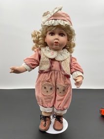 Porcelain Doll in Bear Patch Overalls