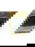 Vintage Chinoiserie Brass Mirror with Etched Floral and Butterfly Details: This striking vintage wall mirror features a trapezoidal brass frame heavily inspired by East Asian Chinoiserie design. The wide brass borders are meticulously etched and inlaid with decorative