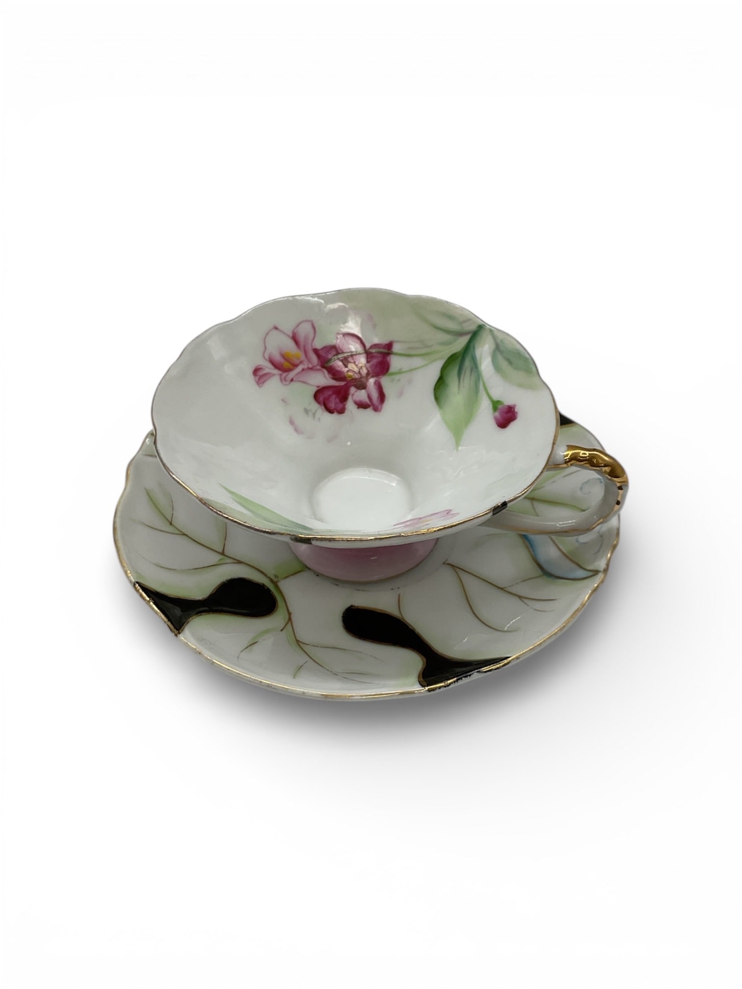 Vintage Porcelain Cup and Saucer Set by Ucasco China: This vintage porcelain cup and saucer set was produced by Ucasco China in Japan during the Occupied Japan period, circa 1945–1952. The set features hand-painted floral decoration with soft pink