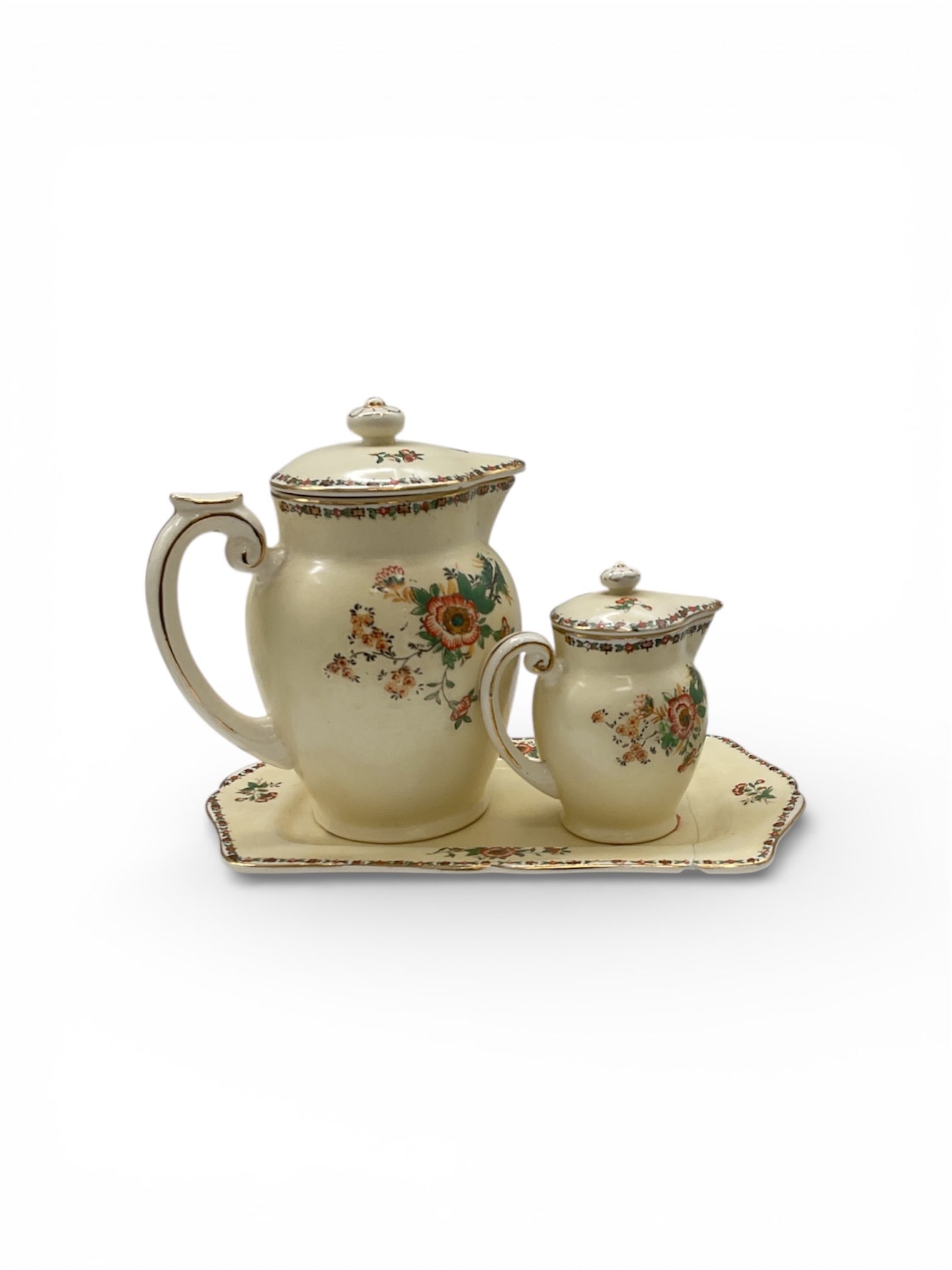 Hand Painted Japan Porcelain Pitcher Set with Matching Platter: This decorative porcelain set consists of a large pitcher, a smaller pitcher, and a matching platter, all hand painted in Japan. The pieces feature a warm ivory ground embellished with delicate