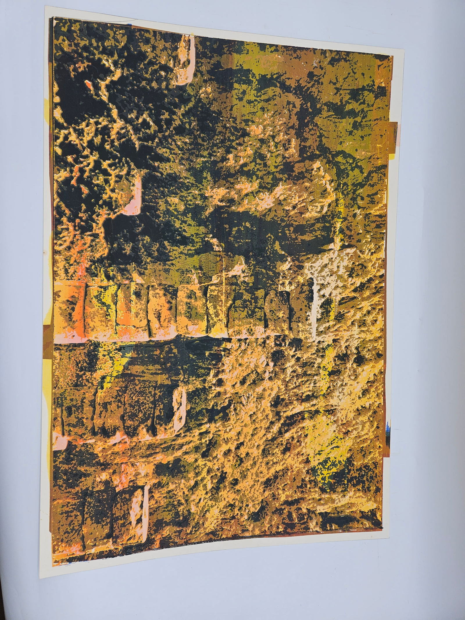 Abstract Landscape Print: Abstract print featuring a landscape with stone structures and textured background. Colors include shades of brown, yellow, and black.