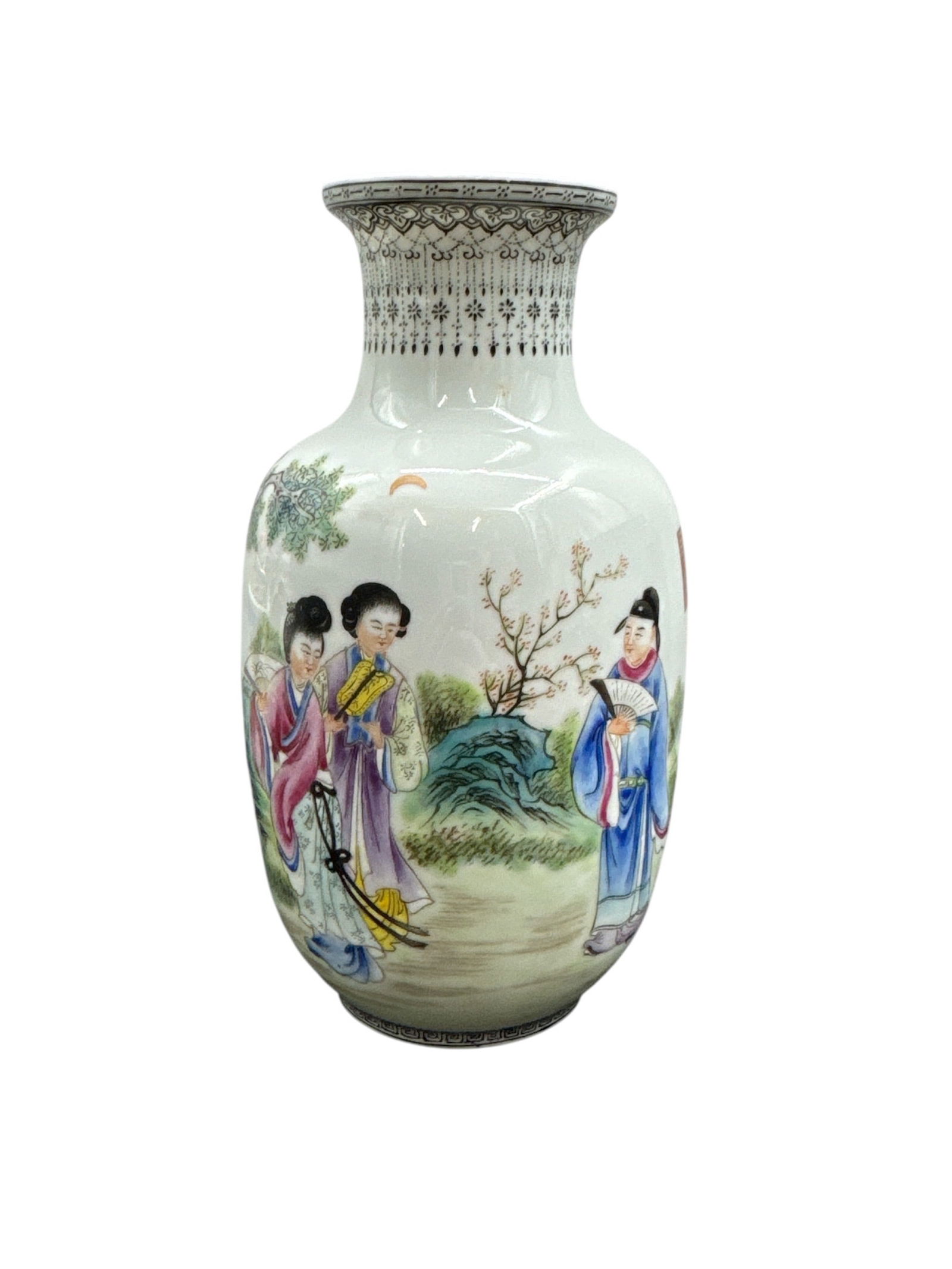 Chinese Porcelain Vase with Figural Garden Scene: This porcelain vase features a finely detailed hand-painted scene depicting elegantly dressed figures in a traditional garden setting, accented by trees and landscape elements. The form is classically