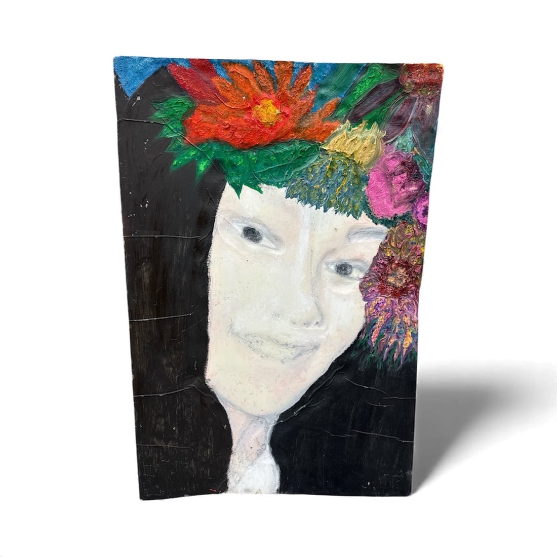 Dulce – by Pingo: A tender mixed-media portrait featuring a serene female face crowned with vibrant, textured flowers. The composition blends expressive color with soft facial detailing, creating a contrast between