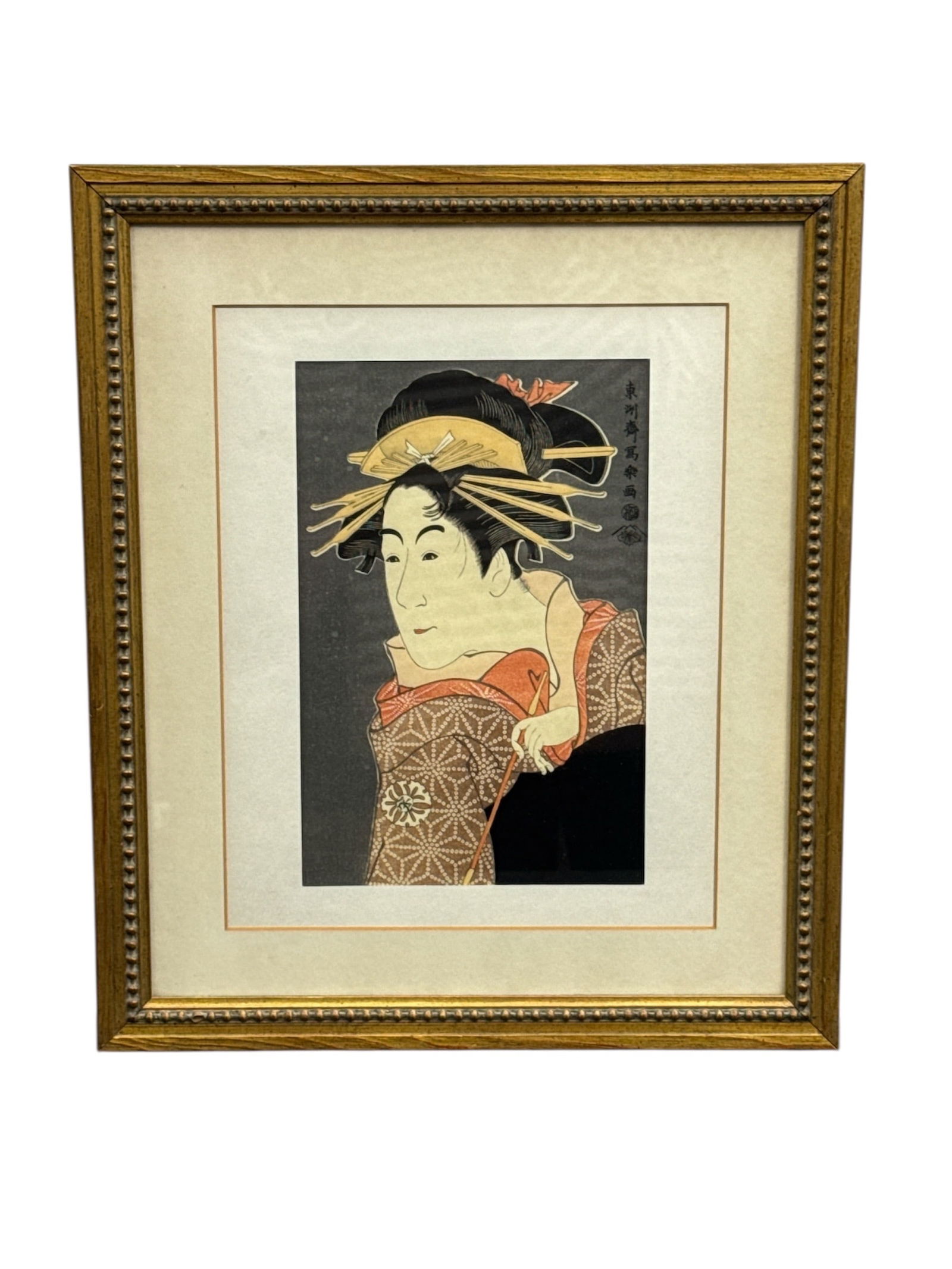 Japanese Ukiyo-e Style Geisha Art Print in Gilt Frame: This lot features a Japanese ukiyo-e style art print depicting a geisha in traditional attire with an ornate hairstyle and patterned kimono. The composition reflects classic Japanese woodblock aesthet