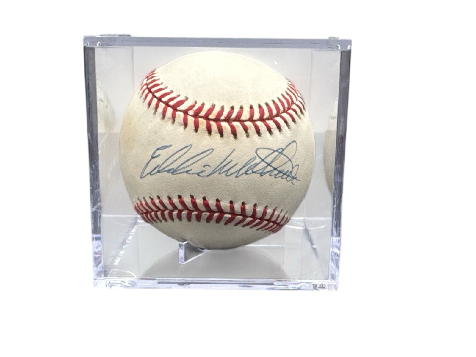 Eddie Mathews Signed Official National League Baseball in Display Case: This autographed Official National League baseball features the signature of Hall of Famer Eddie Mathews, one of the greatest power hitters of his era and a cornerstone of the Boston and Milwaukee Bra
