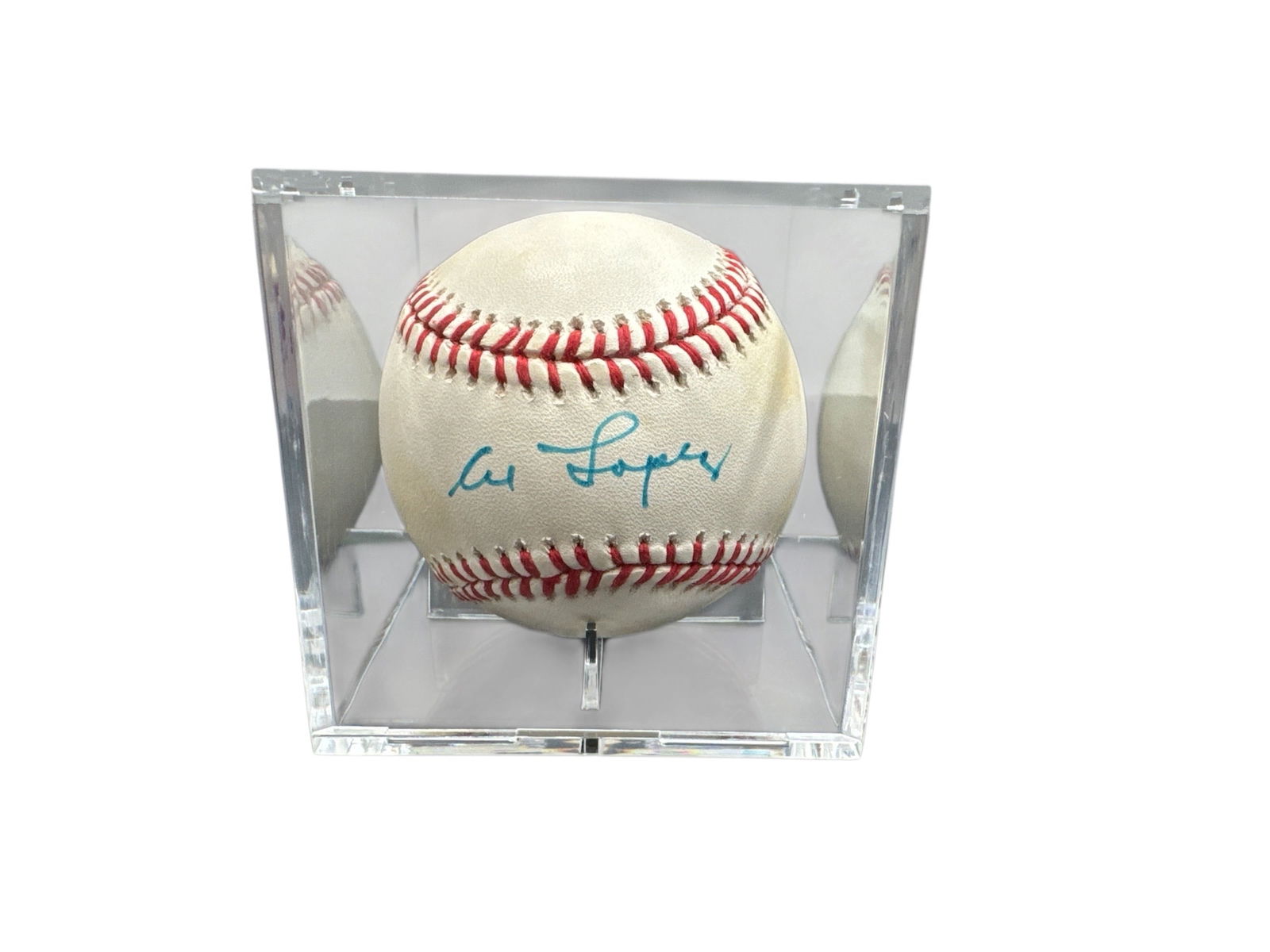 Al Lopez Signed Official American League Baseball with JSA Authentication: This Official American League baseball has been hand signed by Hall of Fame catcher and manager Al Lopez. The autograph is executed in blue ink and is clearly displayed on the sweet spot, presenting
