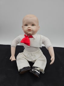 Porcelain Baby Doll with Red Scarf
