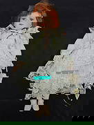 Porcelain Doll with Lace Dress and Parasol: Porcelain doll with red hair and blue eyes, wearing a light blue and lace dress with matching parasol. Stands approximately 17 inches tall.