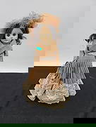 1978 Effanbee Doll: Vintage 1978 Effanbee doll with brown hair and eyes. Dressed in a brown dress with lace trim and matching hat. Includes a small purse. Marked on the back of the neck.