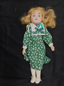 Porcelain Doll with Blonde Hair in Green Floral Dress