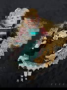 Manley Toys Porcelain Doll with Teddy Bear: Collectible porcelain doll by Manley Toys (USA) Ltd., New York. Features long curly blonde hair, green eyes, and a velvet burgundy and green striped dress trimmed with lace and satin ribbons.