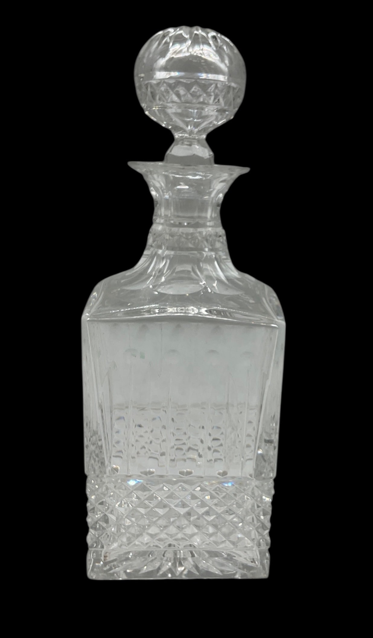 Saint Louis Crystal Decanter: Saint Louis crystal decanter in the classic Tommy pattern, originally designed in 1928. It is a square-shaped, hand-cut, lead crystal decanter known for its clarity and