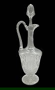 Saint Louis Crystal Decanter: Saint Louis crystal decanter in the highly popular Tommy pattern. This style of handled decanter is often referred to as an "ewer" or "claret jug" and was introduced by