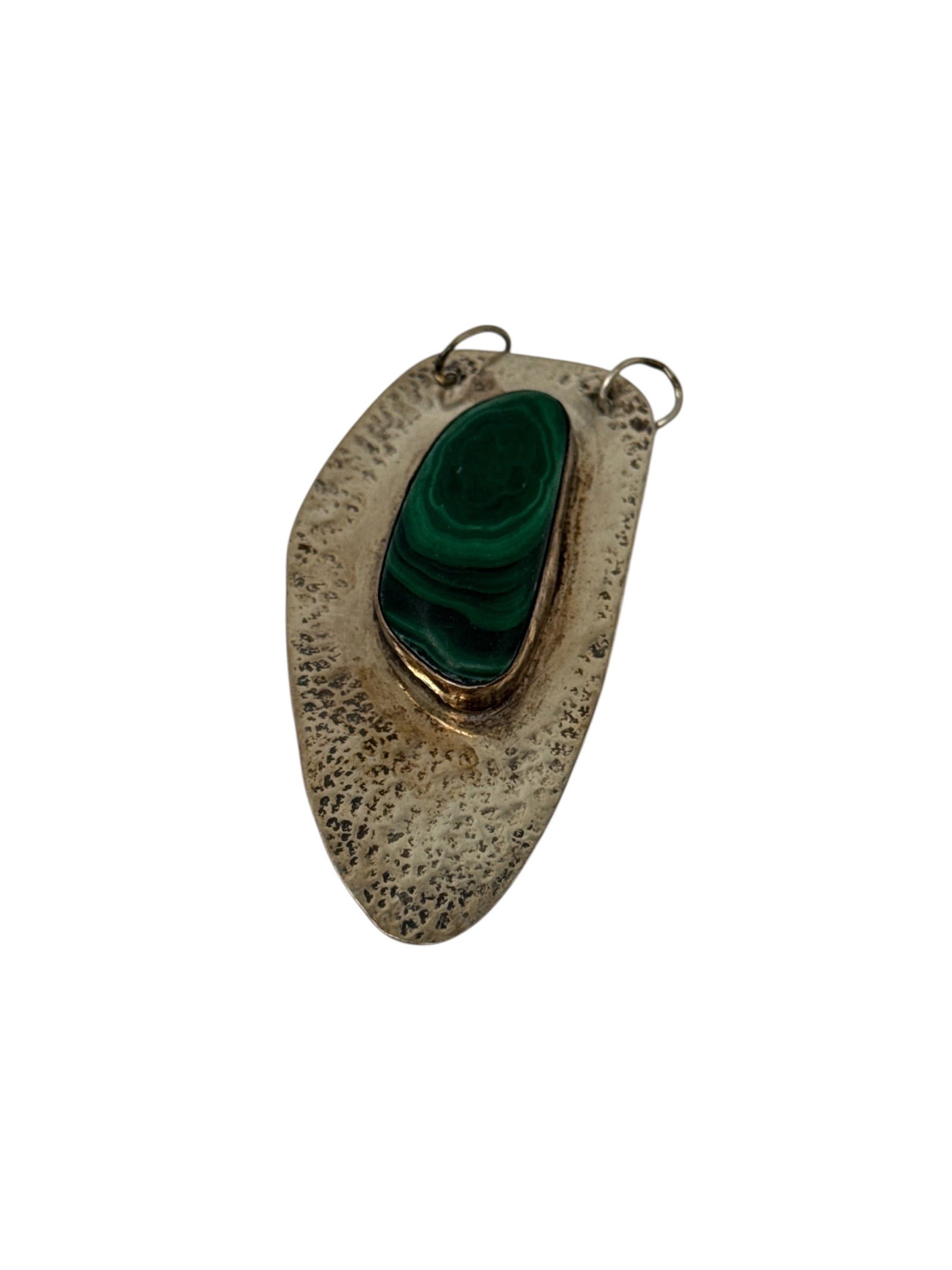 Gloria Landsman Pierce Handcrafted Malachite and Sterling Silver Pendant: This handcrafted pendant was created by artist Gloria Landsman Pierce and features a striking malachite stone set into a hand-cut sterling silver form. The malachite displays rich green banding and na