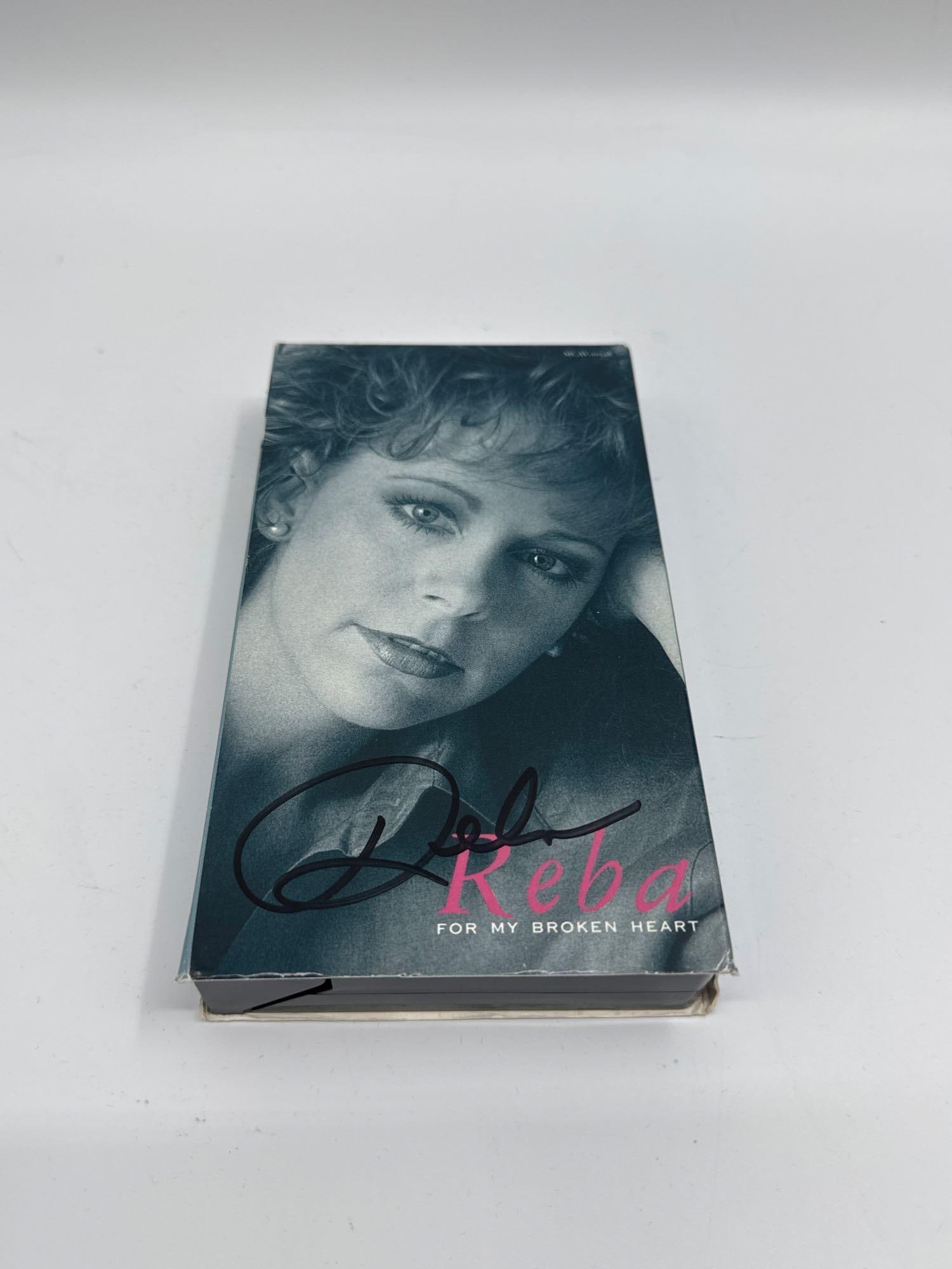 Reba McEntire “For My Broken Heart?? VHS (Signed Cover): Signed VHS copy of Reba McEntire’s “For My Broken Heart,” featuring the country music star’s image on the cover. Potential collector’s item, especially for fans of Reba