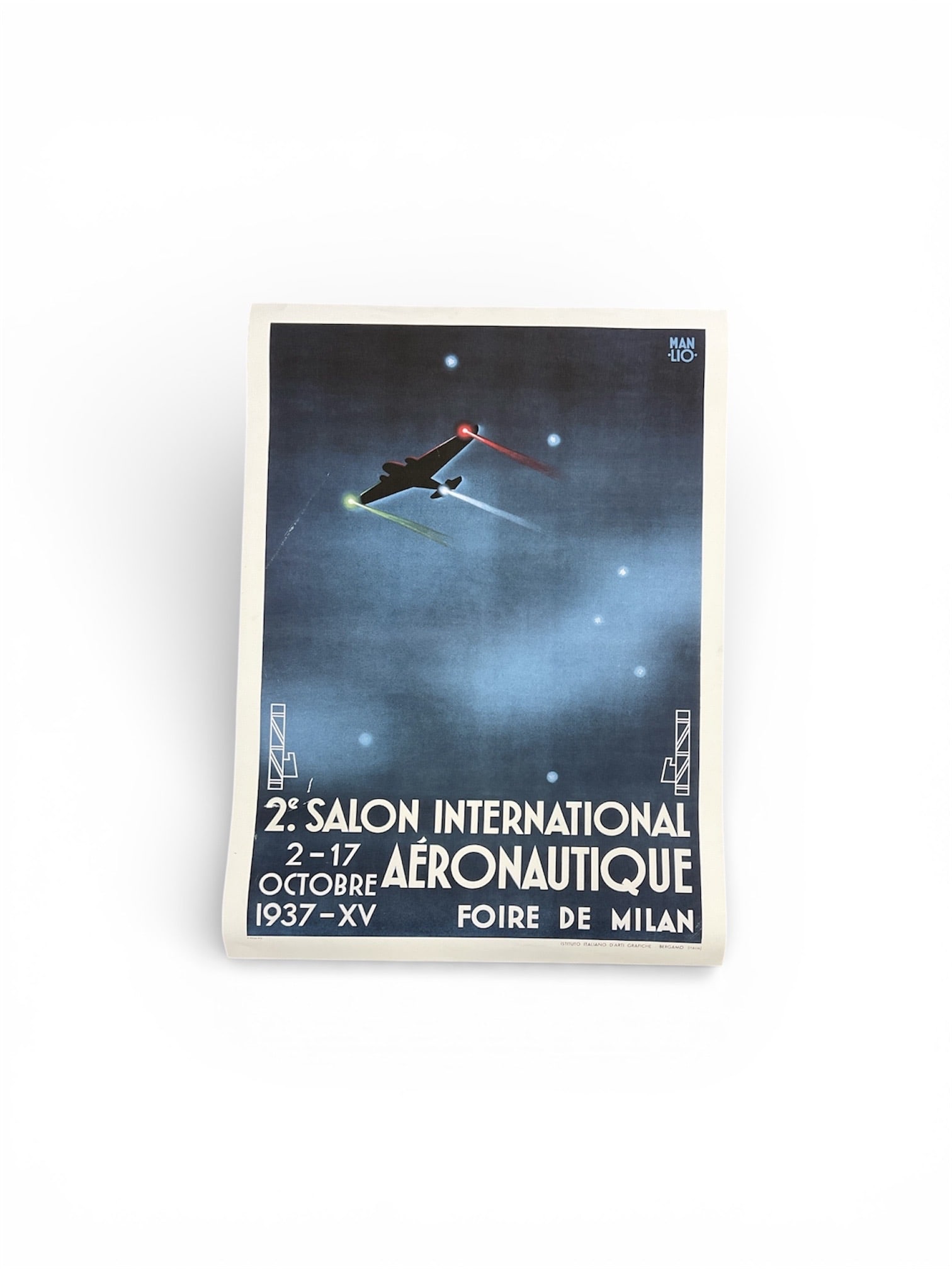 Manlio Parrini II Salone Internazionale Aeronautico Milan Fair 1937 Poster: This exceptionally rare 1937 stone lithograph was designed by the acclaimed Italian artist Manlio Parrini (1901–1968) for the 2nd International Aeronautics Exhibition, held in conjunction with t