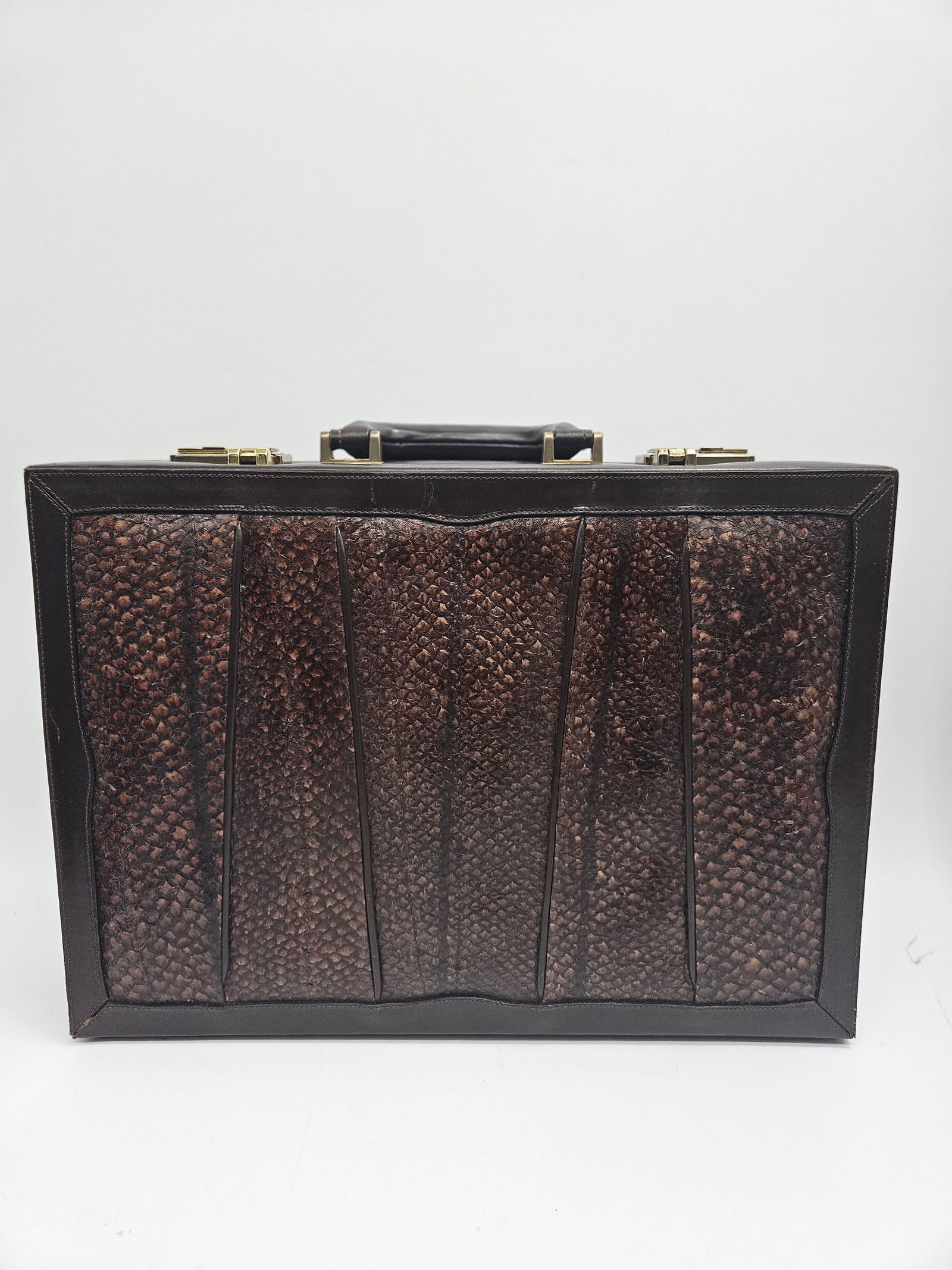 Vintage Brown Leather and Possible Snakeskin Briefcase: Elegant vintage hard-sided briefcase featuring possible snakeskin panels framed in dark leather with gold-tone hardware and beige suede interior. Includes organized compartments for documents and
