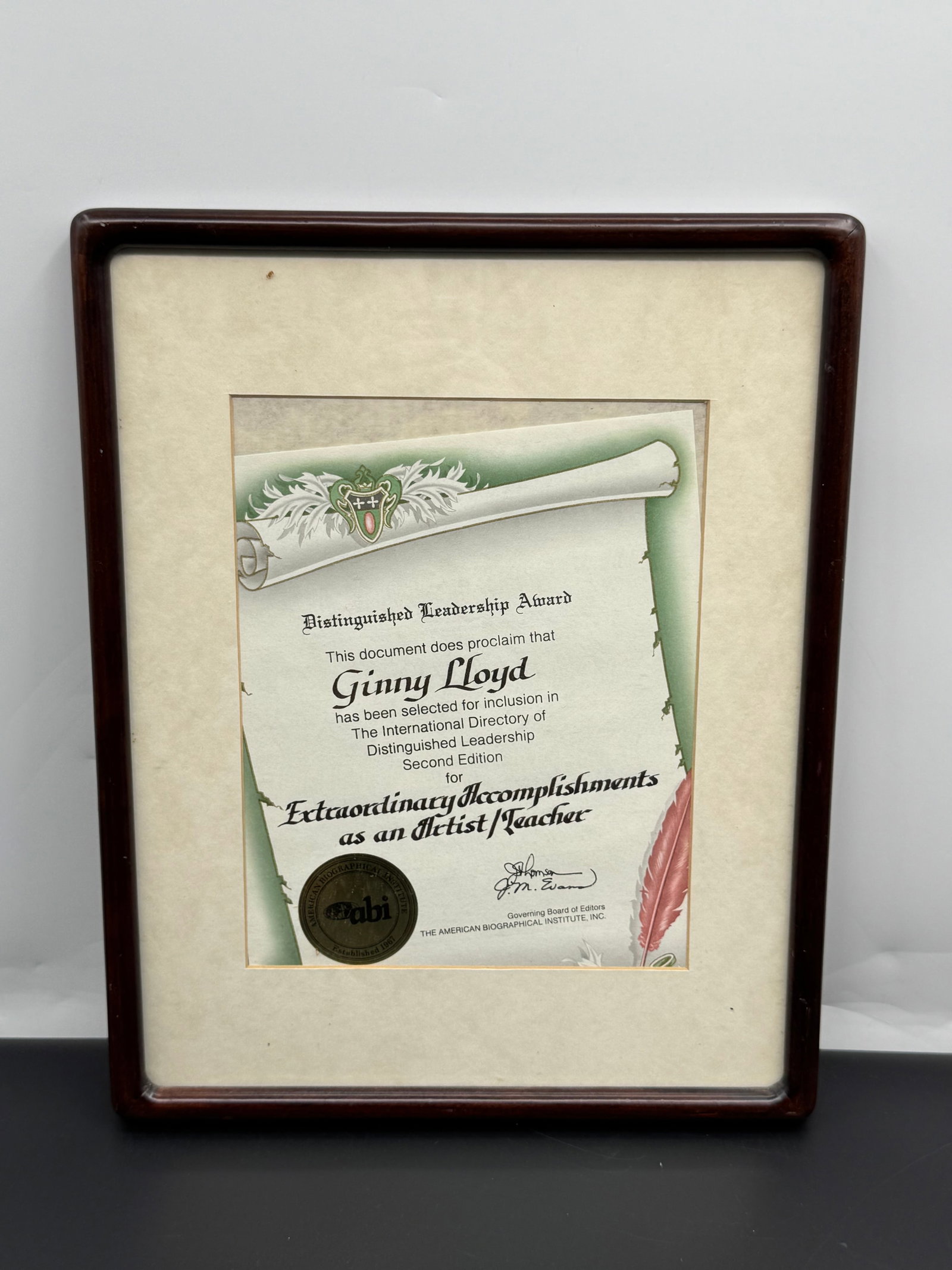Ginny Lloyd Distinguished Leadership Award Certificate, American Biographical Institute, Framed,: Ginny Lloyd Distinguished Leadership Award Certificate, American Biographical Institute, late 20th century.Framed dimensions: 15 x 12 in.A framed Distinguished Leadership Award certificate presented