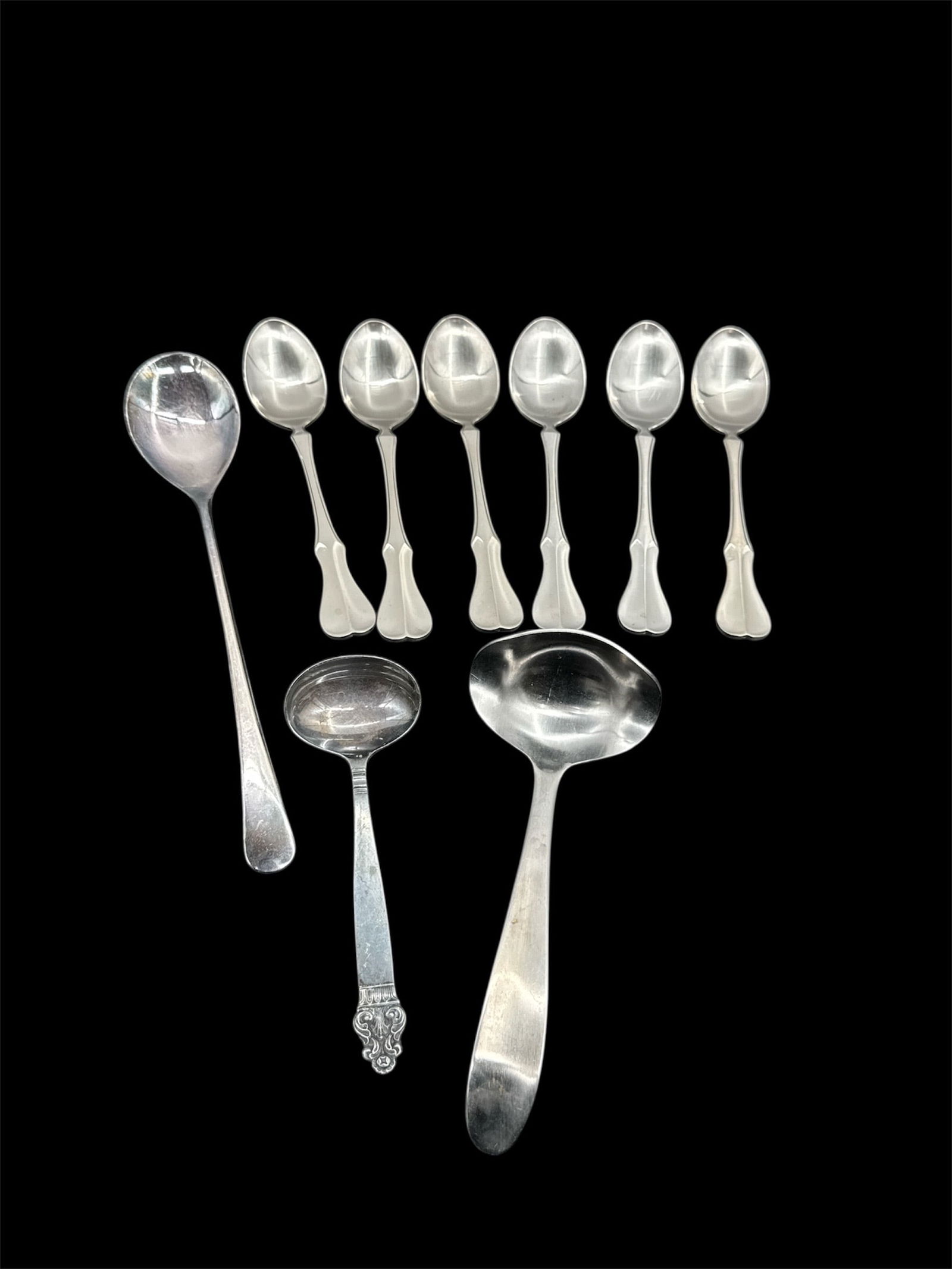 Stainless Steel Spoons and Ladles - Set of 9: Set of 9 stainless steel spoons and ladles. Marked 'Stainless Steel Japan'. Includes various sizes of spoons and ladles.