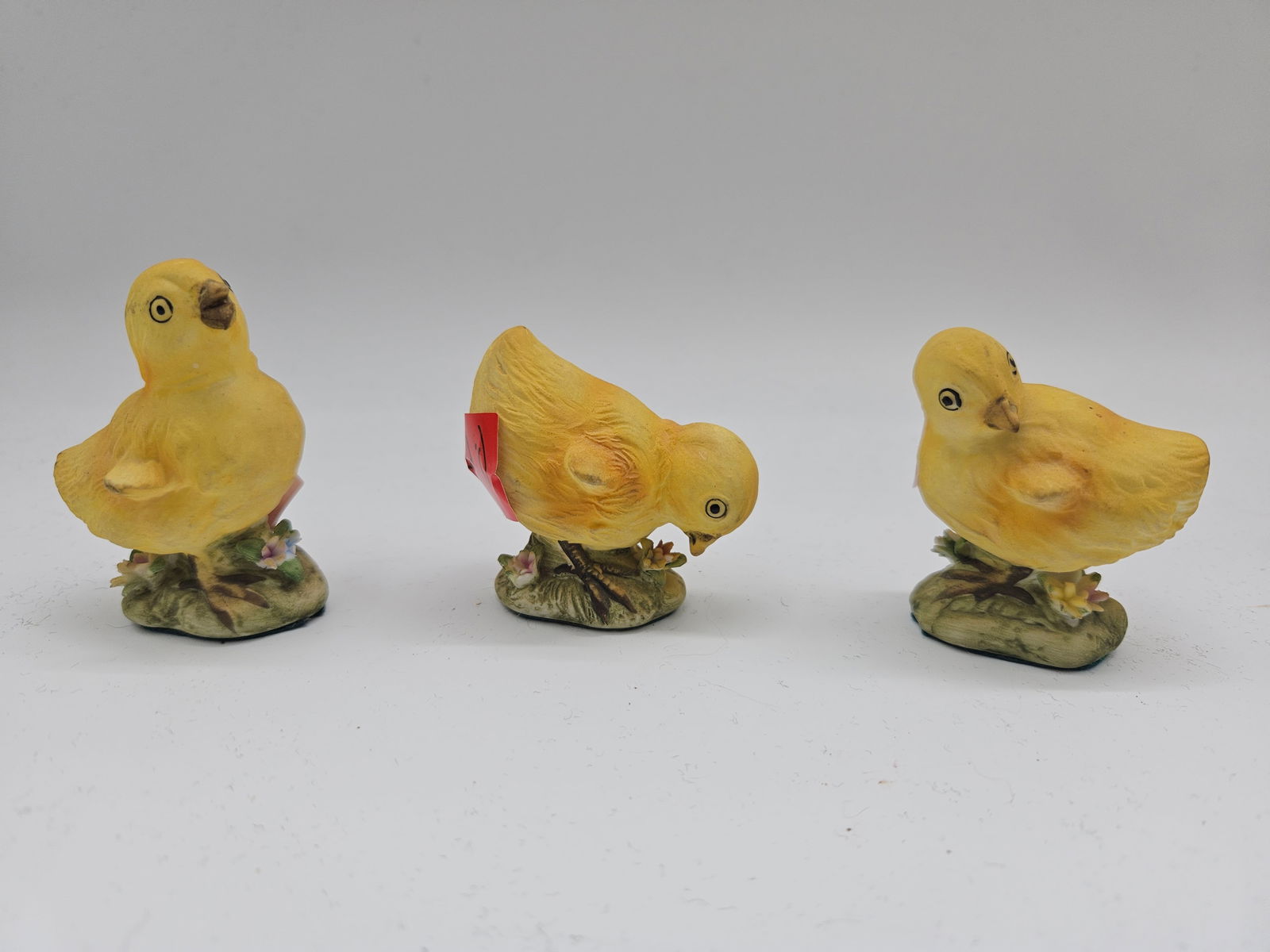 Three KW 1997 Chick Figurines: Set of three KW 1997 chick figurines. Each is approximately 2-3 inches in height. Cute decorative collectibles.
