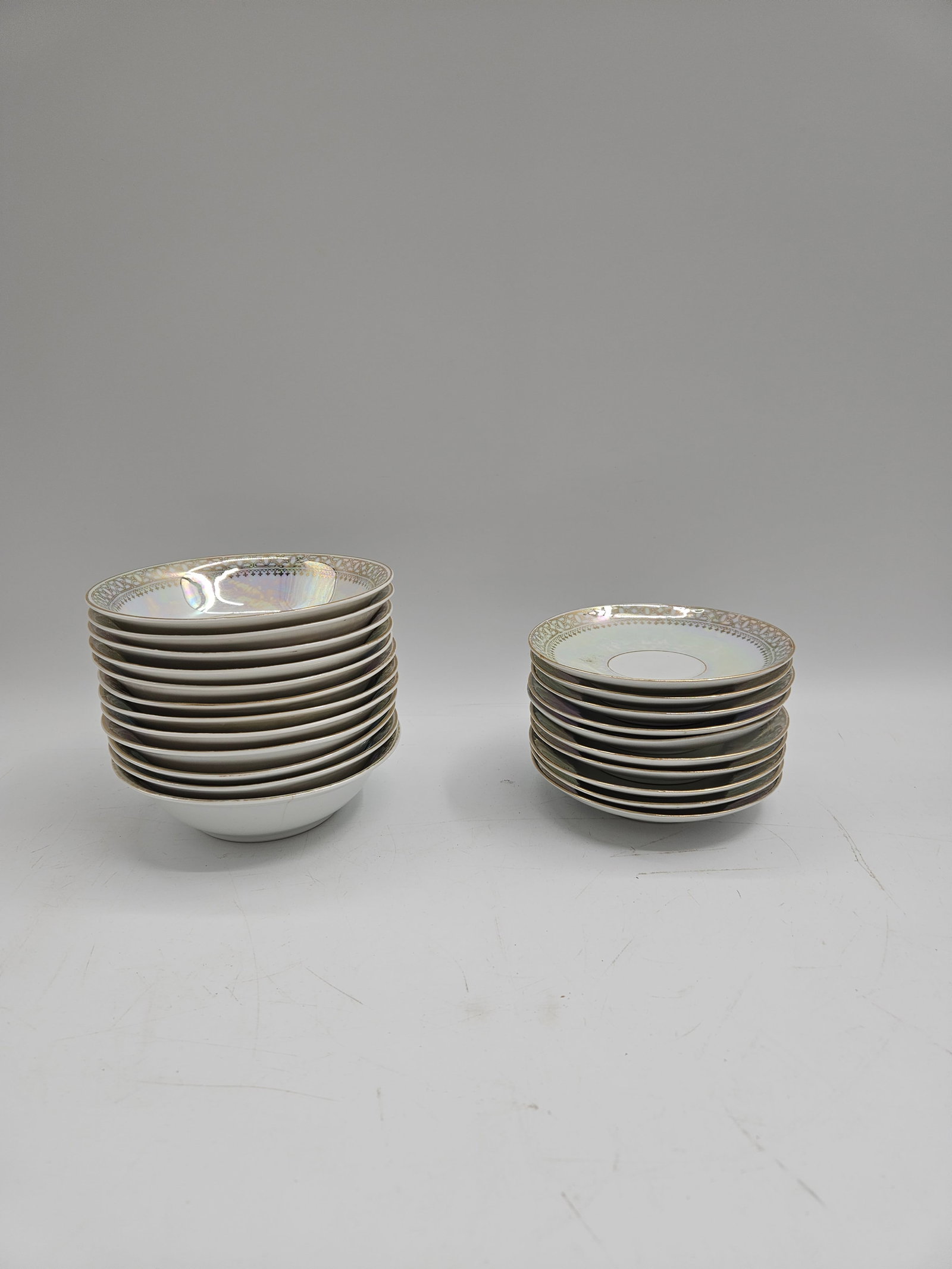 Bavaria Porcelain Dinnerware Set – 12 Bowls and 10 Plates: Refined Bavaria porcelain set featuring 12 bowls and 10 plates, each accented with a shimmering gold band on crisp white porcelain. Exemplifies the classic quality and craftsmanship associated with