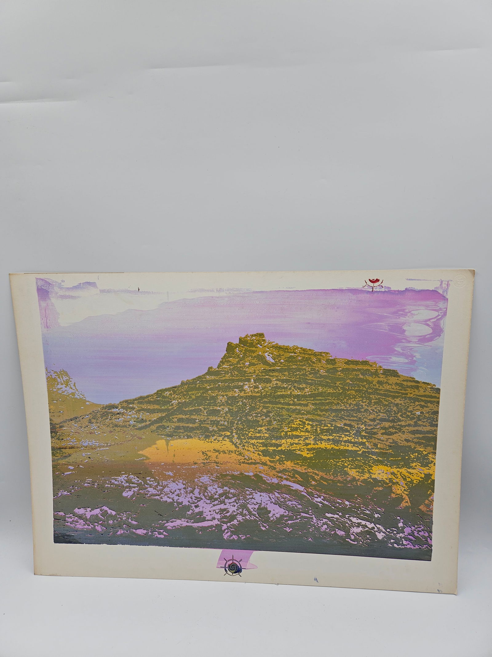 Abstract Mountain Landscape: Abstract print depicting a layered mountain scene in hues of gold, lavender, and violet. The composition blends natural forms with expressive color transitions, giving a dreamlike impression of a