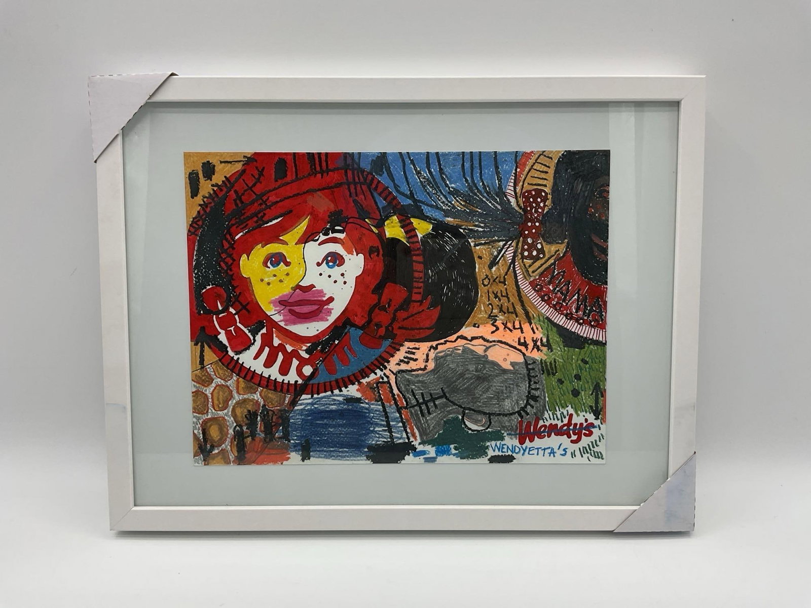 Wendyetta’s by Daniel Garcia (Cuban/American) Mixed Media: Framed mixed media work by Daniel Garcia incorporating the Wendy’s logo and character in a bold, layered composition critiquing branding, identity, and commercial culture.Dimensions: H13in