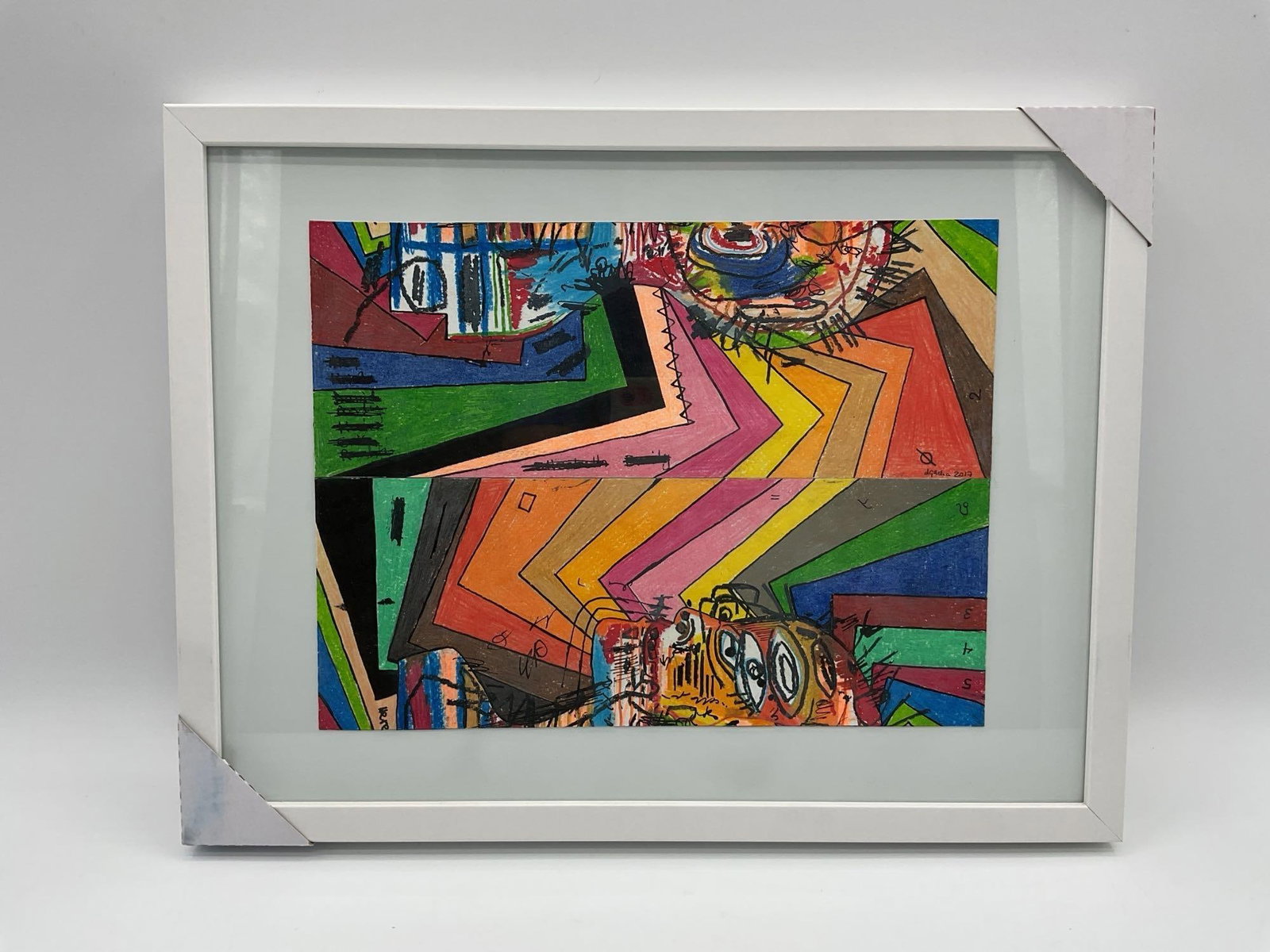 Split Spectrum Faces by Daniel Garcia (Cuban/American) Mixed Media:  Framed abstract drawing by Daniel Garcia featuring two expressive faces embedded in a zigzag pattern of vibrant color bands, exploring identity and fragmentation.Dimensions: H13in L17inMedium: