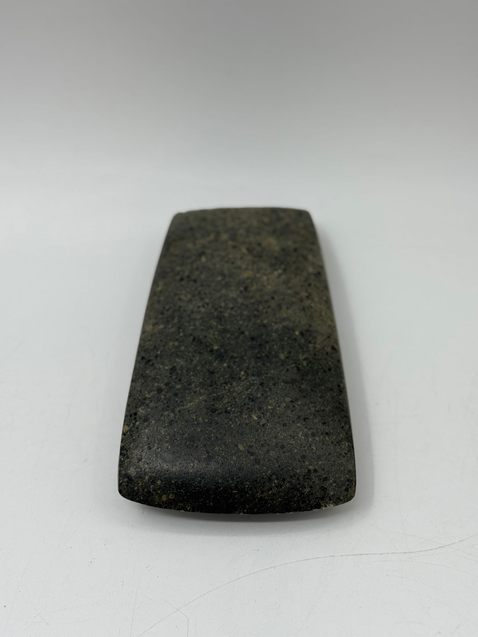Pre-Colombian Stone Celt (Axehead): A genuine and nicely crafted example of an ancient Pre-Columbian stone celt or hand axe, likely originating from Colombia or Ecuador. This artifact showcases the meticulous craftsmanship of ancient pe