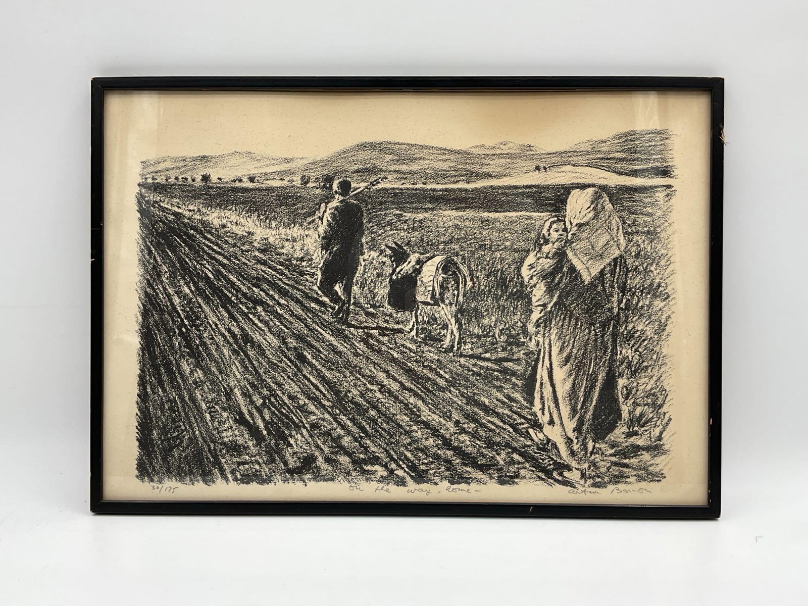 "On the Way Home" by Arthur Bar-On (Israel, b.1943) Lithograph: A limited edition black and white lithograph depicting a rural family scene, with figures and a donkey traveling along a dirt path. The somber yet serene composition reflects themes of return,