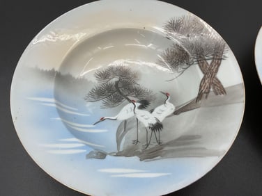 Pair of Hand-Painted Porcelain Plates with Crane and Landscape Design
