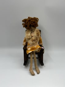 Folk Art Doll on Rocking Chair