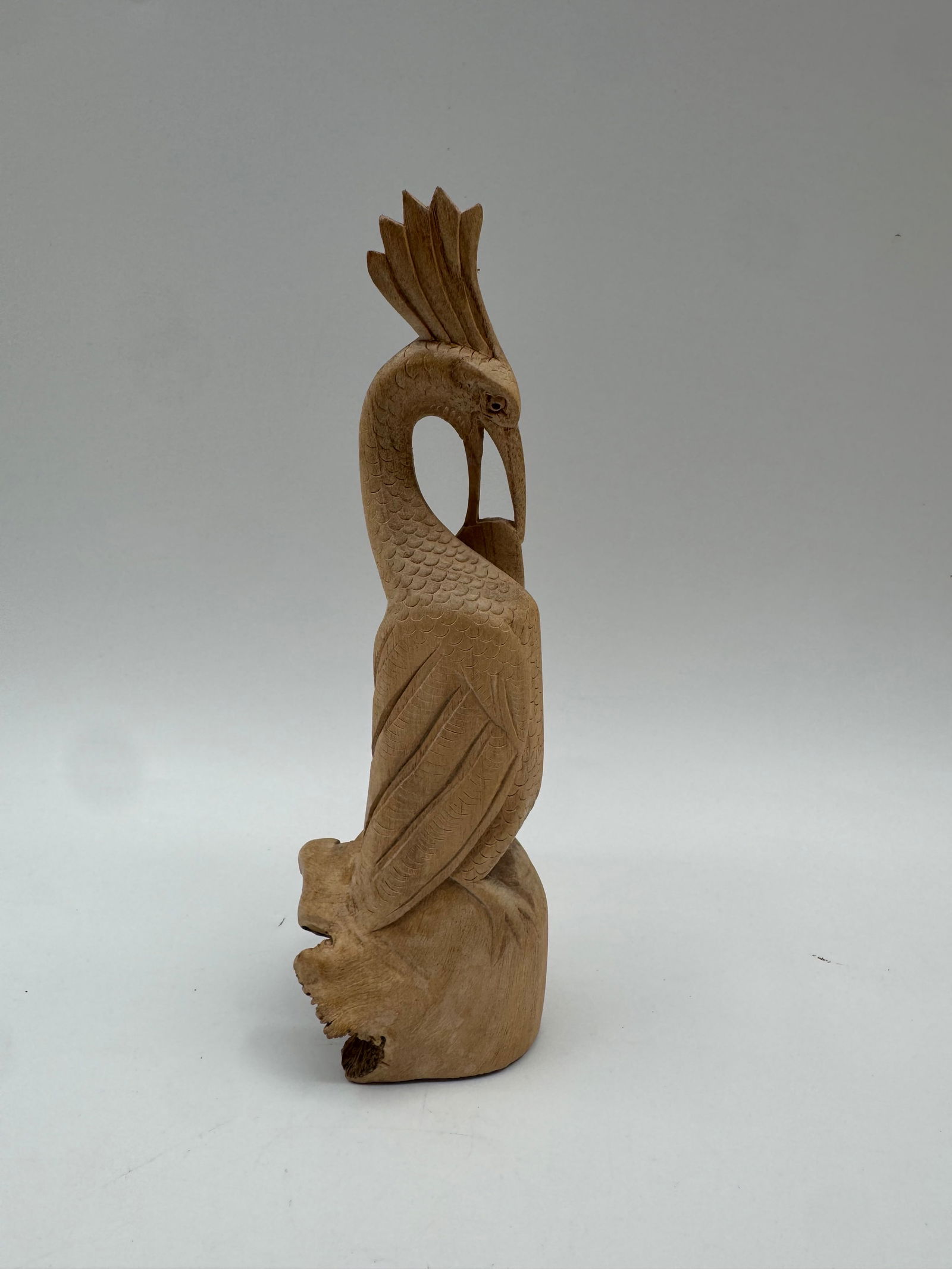 Hand Carved Wooden Bird Sculpture, Montserrat: Hand carved wooden bird sculpture. Inscribed with 'Montserrat' on the base. Measures 8.5" high and 2.5" wide.