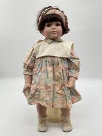 Vintage Porcelain Baby Doll in Floral Outfit
