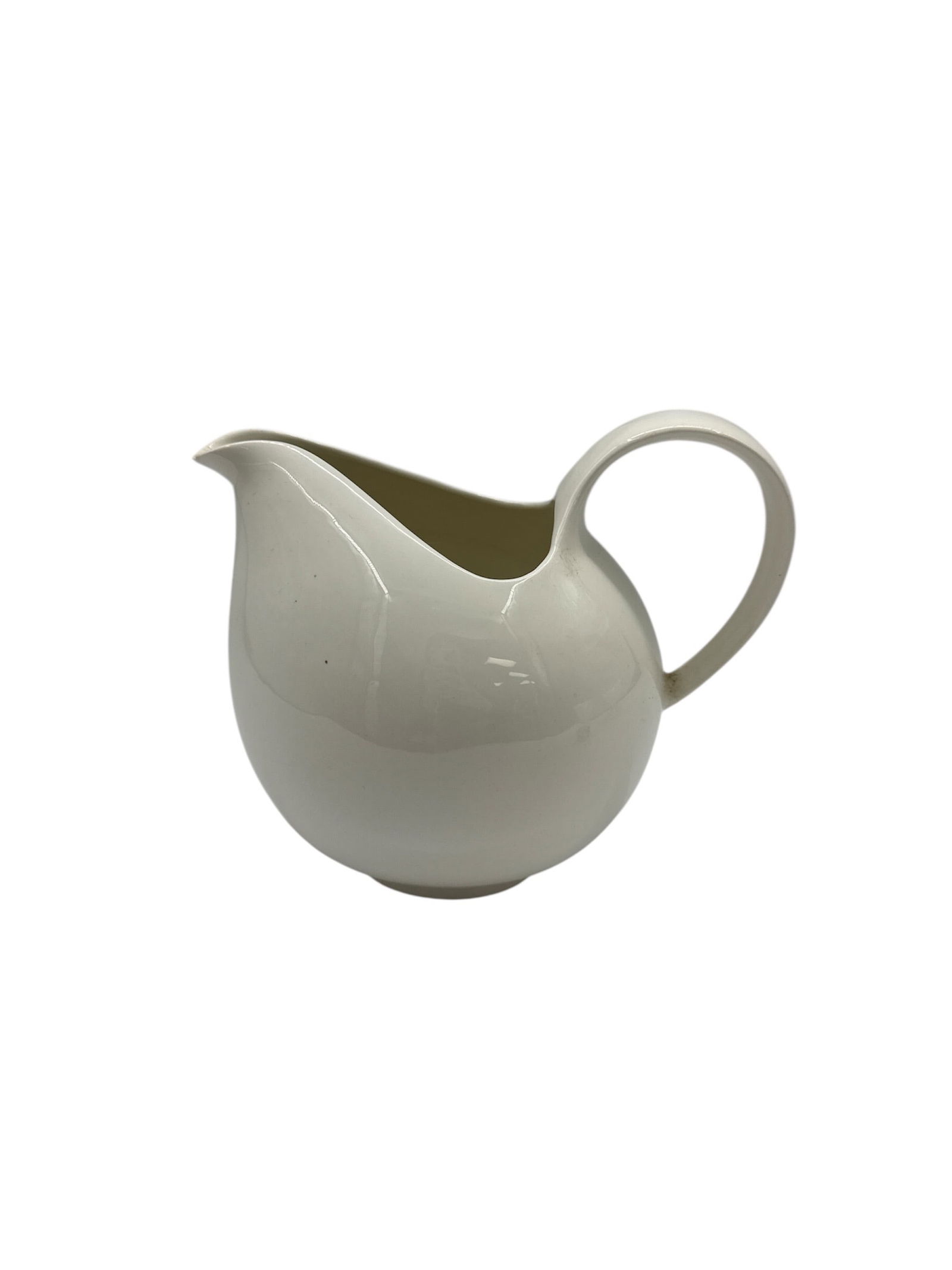 Hallcraft by Eva Zeisel Creamer: Hallcraft by Eva Zeisel creamer. Marked on the bottom. Dimensions: H:8in L:9in W:6in *tiny chip on spout