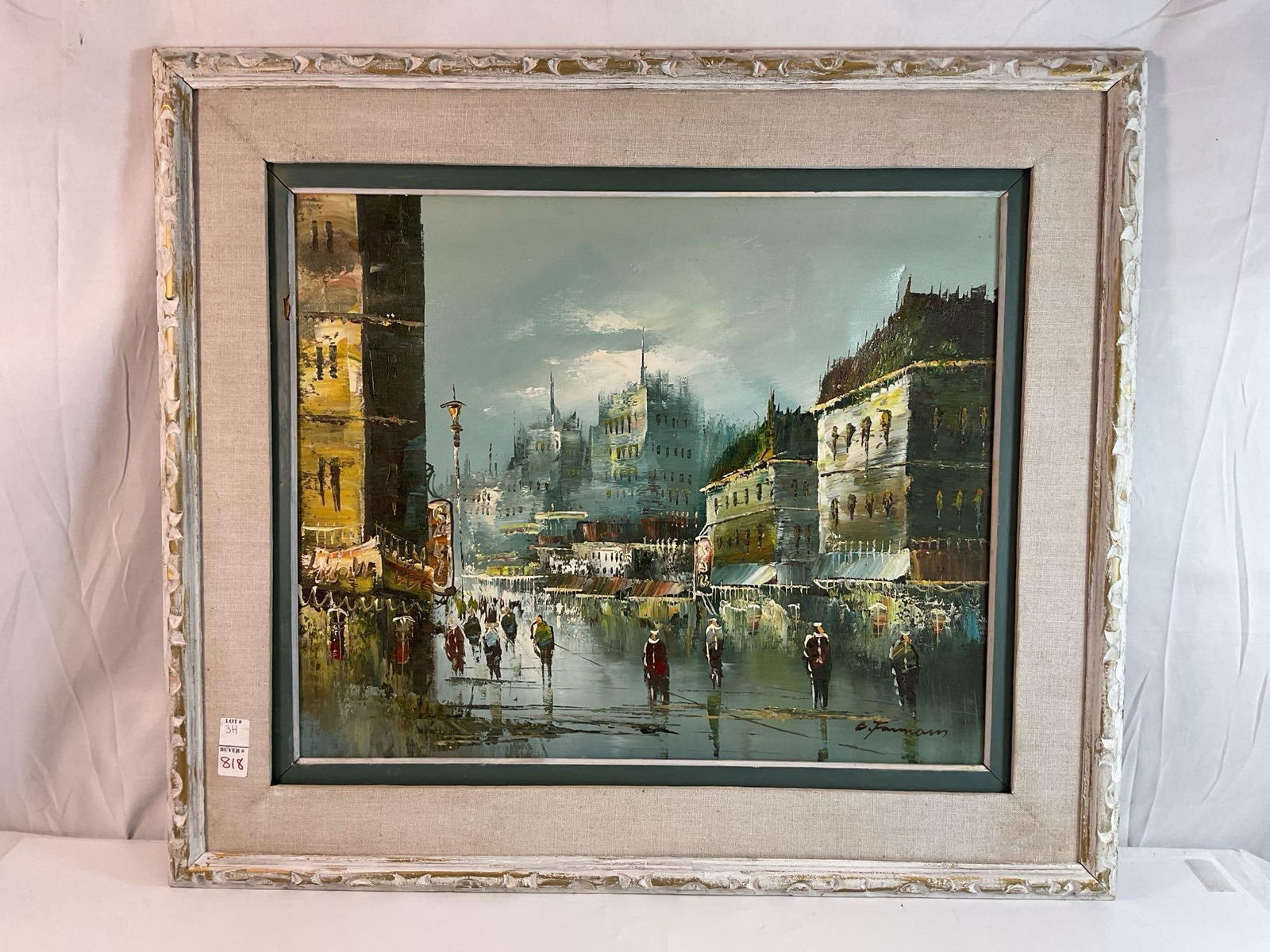 European Cityscape Oil Painting Signed "C. Furmam" in Vintage Frame: This is a vibrant cityscape oil painting, depicting a bustling European street scene at dusk or evening, with historic buildings, glowing streetlights, and figures walking along wet cobblestone street