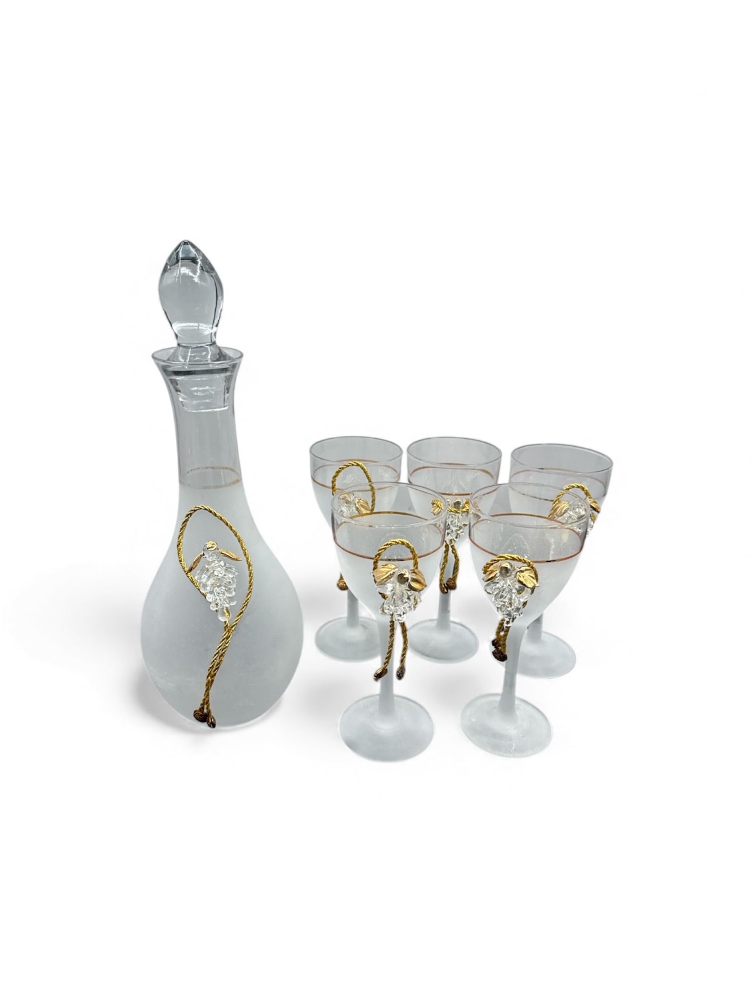 Silvestri Arte Murano Wine Set With Decanter and 5 Glasses: Frosted glass decanter with stopper, featuring gold accents and five matching glasses. Decanter: 12" H x 4" W. Glasses: 6.5" H x 2.5" Diameter.