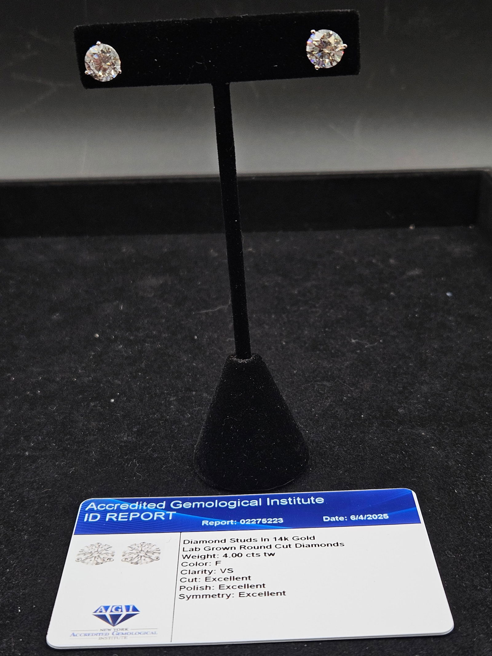 4.00 ct Lab-grown Diamond Stud Earrings with AGI Report: An impressive pair of lab-grown diamond stud earrings set in 14K white gold, showcasing two round brilliant-cut diamonds totaling 4.00 carats. Certified by the Accredited Gemological Institute (A