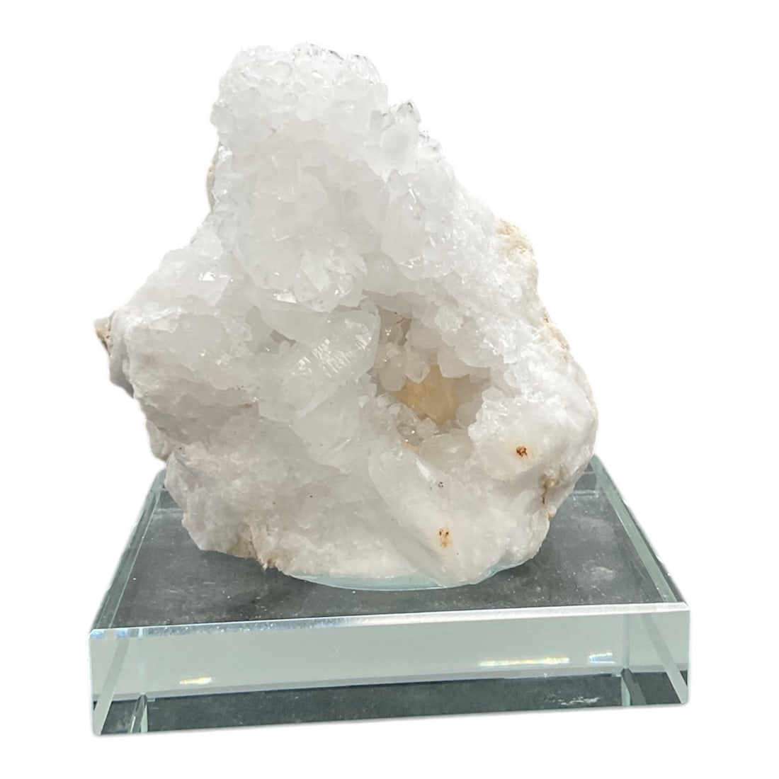 Natural Crystal Cluster on Glass Display Base: This striking natural crystal cluster is presented on a clear glass display base, creating a clean and modern presentation suitable for shelf, desk, or cabinet display. The cluster features