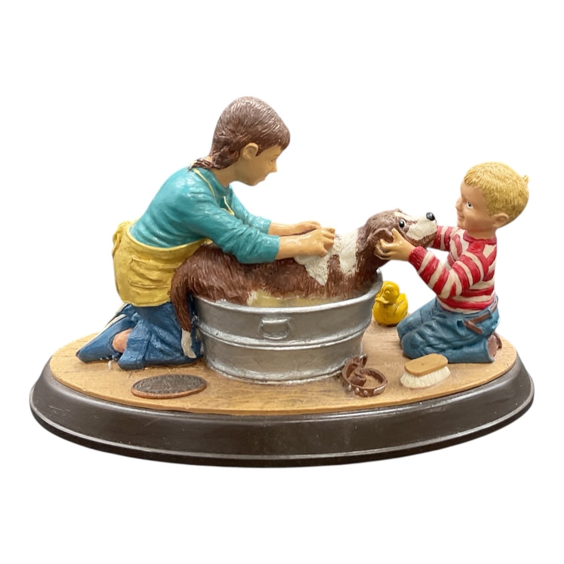 Norman Rockwell Family Trust Authorized Edition Splish Splash Figurine: This Norman Rockwell Family Trust Authorized Edition figurine titled Splish Splash charmingly captures a classic Rockwell-inspired moment of childhood innocence and warmth. The scene portrays two