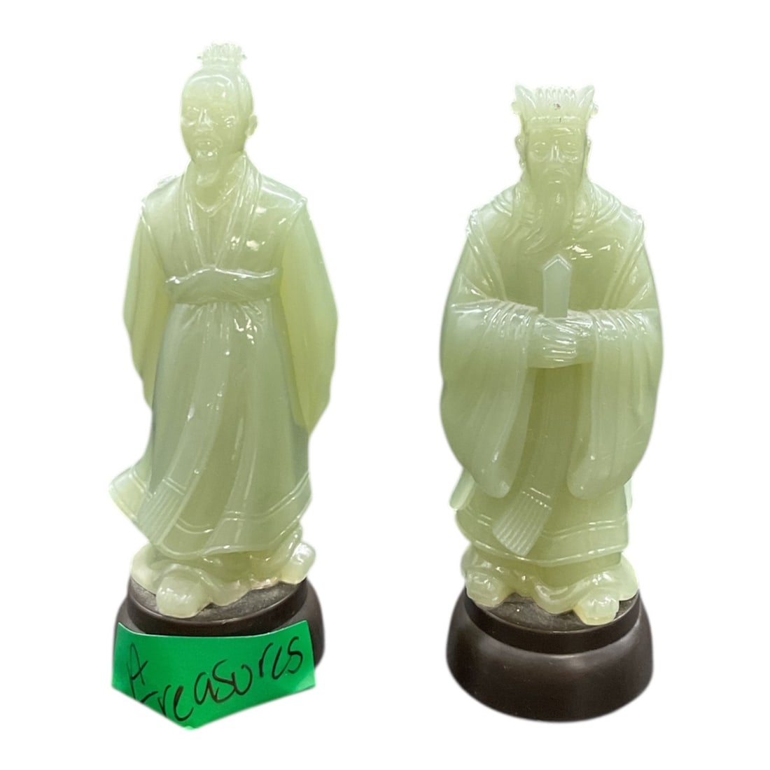 Pair of Scholar Figures on Wooden Bases: This pair of decorative figures represents traditional Chinese scholar or courtly figures, executed in a translucent jade color material rather than carved jade. Each figure is modeled with flowing