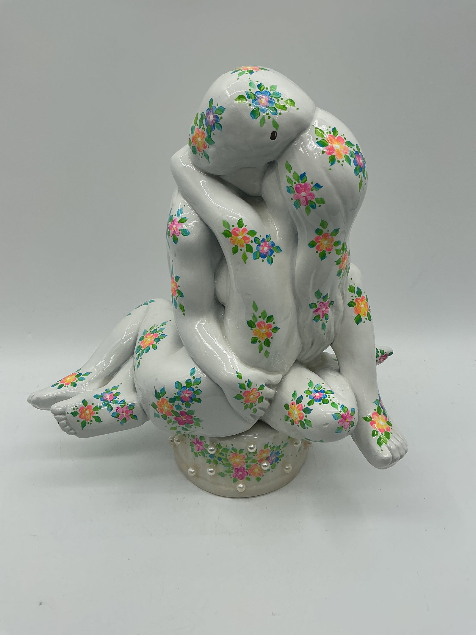 Love Is in the Air by Rasma Vittkofska Contemporary Sculptural Artwork 2022: Expressive contemporary sculptural work titled Love Is in the Air by Rasma Vittkofska, created in 2022. The composition depicts two intertwined human figures seated in an intimate embrace, their bodie