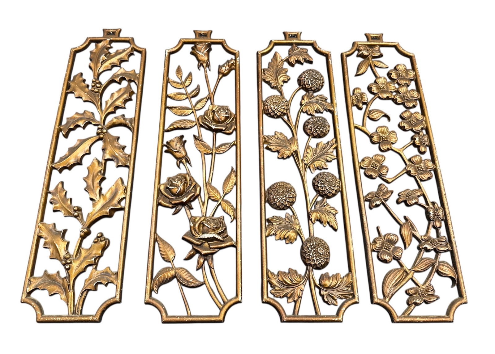 Sexton Cast Metal Floral Wall Panels Set of Four: Set of four decorative cast metal wall panels by Sexton, each featuring an openwork floral and botanical motif. The panels display stylized flowers, leaves, and stems rendered in raised relief with a