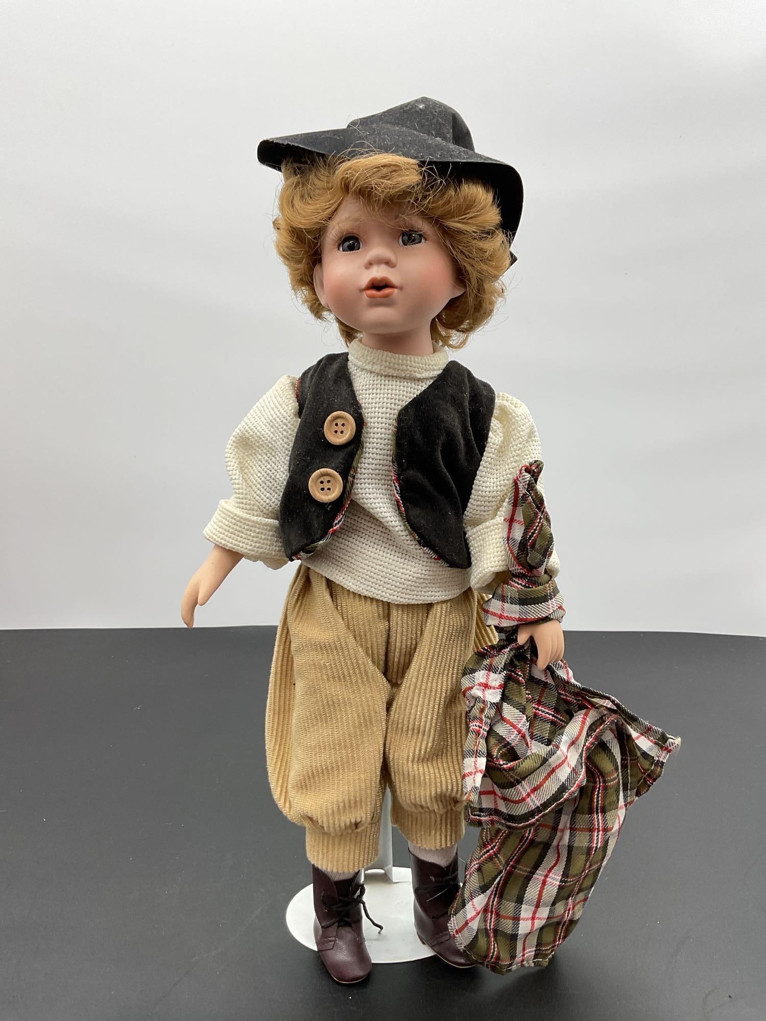 Porcelain Boy Doll in Newsboy Outfit with Plaid Blanket (1 of 3)