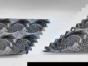 Vintage Metal Muffin Baking Pan: Rustic six-cup muffin or cupcake baking pan made of speckled metal, featuring a hammered-like pattern and a hole at the top for hanging. Shows signs of age and use, adding to its farmhouse charm.