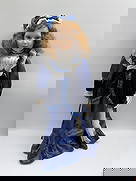 Crowne Fine Porcelain Doll with Blue Velvet and Lace Dress: Charming Crowne Fine Porcelain Doll dressed in a stunning royal blue satin gown with velvet bodice and lace trim. The doll features curly auburn hair, blue eyes, and a matching bonnet with r